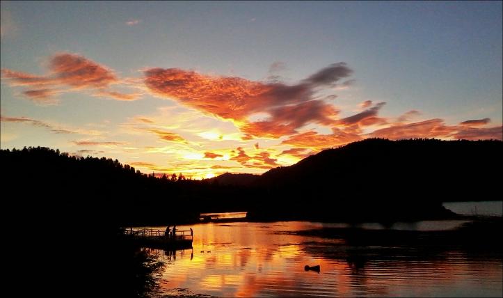 sunset over boulder bay park in big bear lake ca
